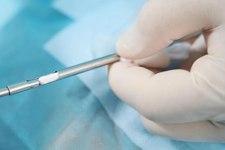 Hormone-Pellet-Therapy Close up of a doctor inserting a hormone pellet into a delivery device for hormone pellet treatments from Delara Tavakoli, M.D. of Tavicare in Chevy Chase.