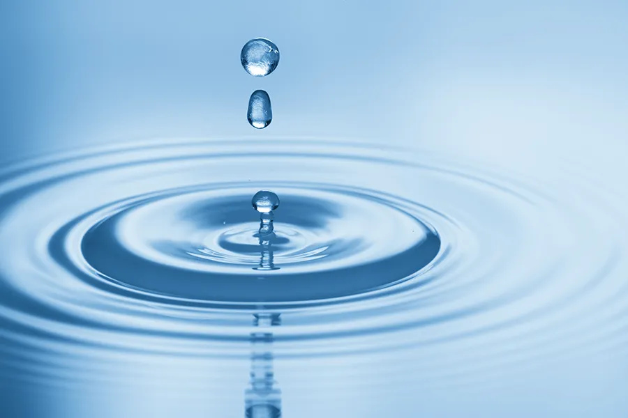 Hydration-IV-Therapy-Clinic Drops of water rippling in a smooth pool. Get Hydration IV Therapy from Delara Tavakoli, M.D. of Tavicare in Chevy Chase.