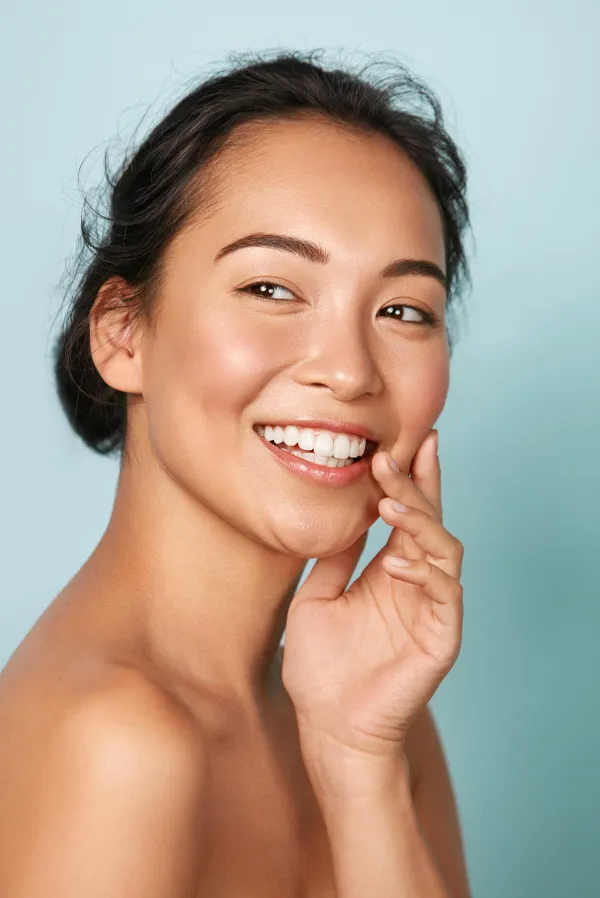 RenaSculpt-Facial-Tightening-Treatment An asian woman with glowing skin. Get RenaSculpt Facial Tightening treatment from Delara Tavakoli, M.D. of Tavicare in Chevy Chase.