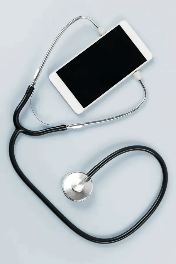 Telemedicine-Treatment A smartphone with a stethoscope attached to it, symbolizing Telemedicine treatment from Delara Tavakoli, M.D. of Tavicare in Chevy Chase.